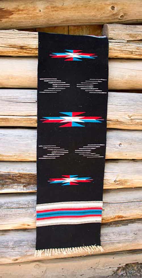 black table runner with red, blue and white highlights