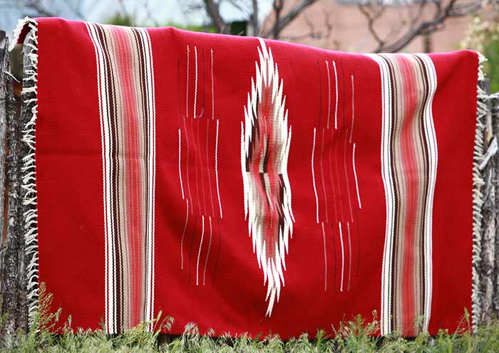 red rug with stripes and diamond pattern